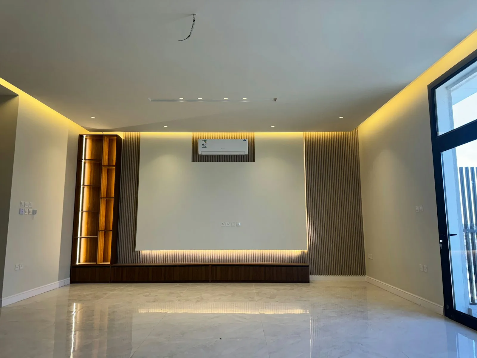 Modern interior with a wall-mounted air conditioner and natural light
