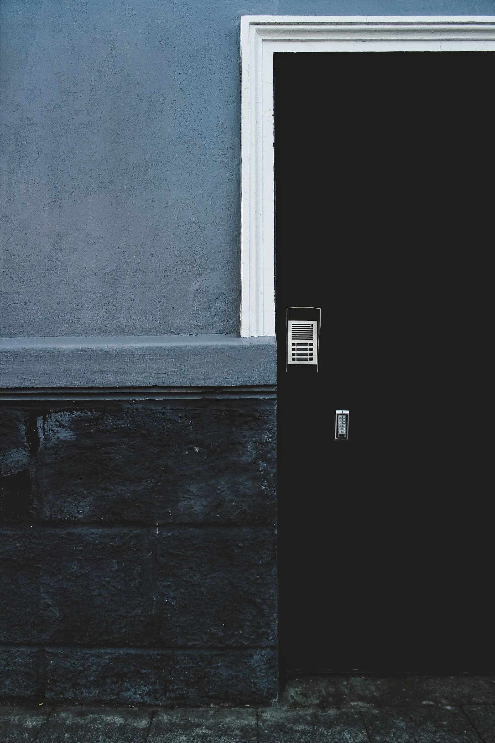 Dark contemporary entrance with intercom and access keypad